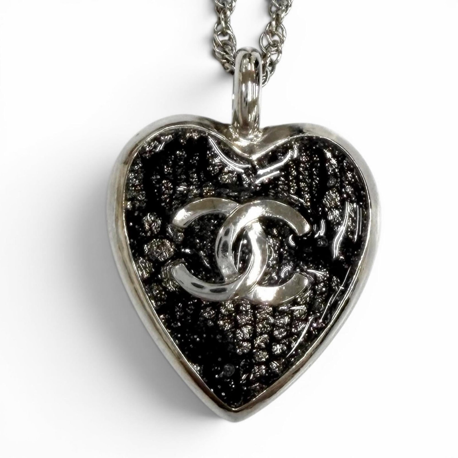 Coco Chanel Silver Mark Lace Necklace Pendant Heart Made In France For Women: Coco Chanel Silver Mark Lace Necklace Pendant Heart Made In France For Women Made in France, this Coco Chanel silver mark lace necklace pendant features a delicate heart design. The necklace measures