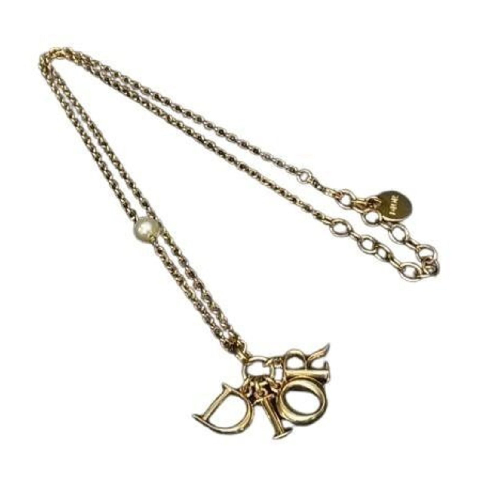 Christian Dior Swing Women'S Necklace Gold Metal Faux Pearl: Christian Dior Swing Women'S Necklace Gold Metal Faux Pearl Gold metal faux pearl pendant from Christian Dior, featuring an 8mm x 8mm design with a 44 cm / 17.32'' adjustable neck circumference. This 
