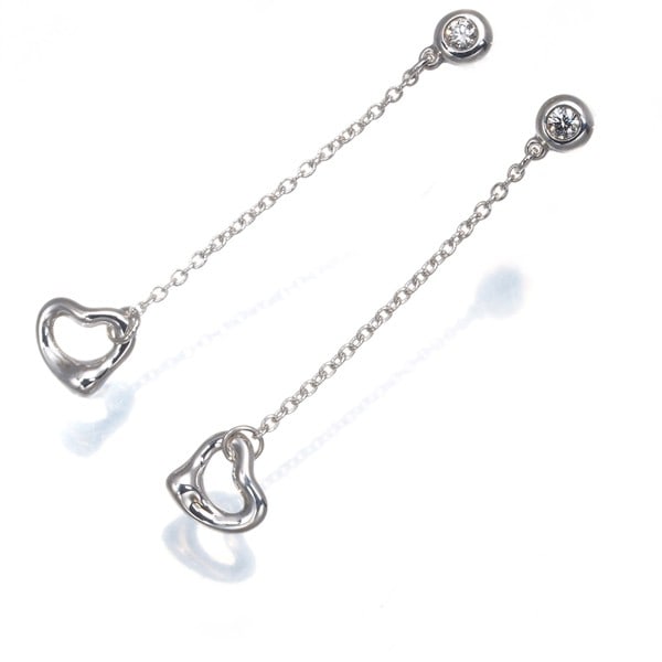 Tiffany&Co. Earrings By The Yard Diamond Silver 925: Tiffany&Co. Earrings By The Yard Diamond Silver 925 Sterling silver earrings by Tiffany & Co. feature an open heart design, adorned with a natural diamond weighing 0.12 carats total. The By The Yard