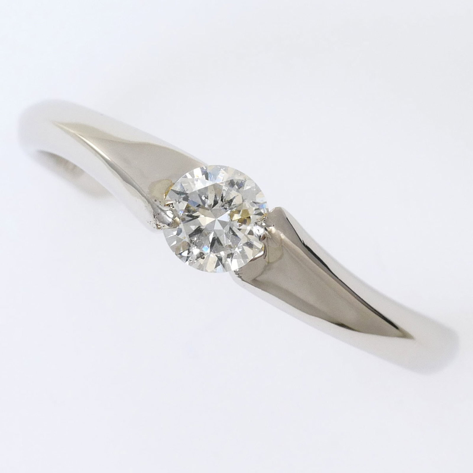 Unbranded Band Ring Platinum 900: Unbranded Band Ring Platinum 900 Platinum 900 band ring features a diamond stone weighing 0.20 carats, set in a sturdy platinum metal construction with a US size 5.5 fit and a width of 4mm. The ring's