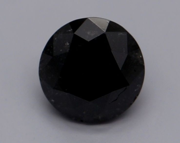 GIA Round 0.69ct Fancy Black VVS2 - Loose Natural Diamond: GIA Round 0.69ct Fancy Black VVS2 - Loose Natural Diamond GIA certified, the 0.69ct Fancy Black VVS2 diamond boasts exceptional clarity and polish, with an EX cut that maximizes its brilliance. Its