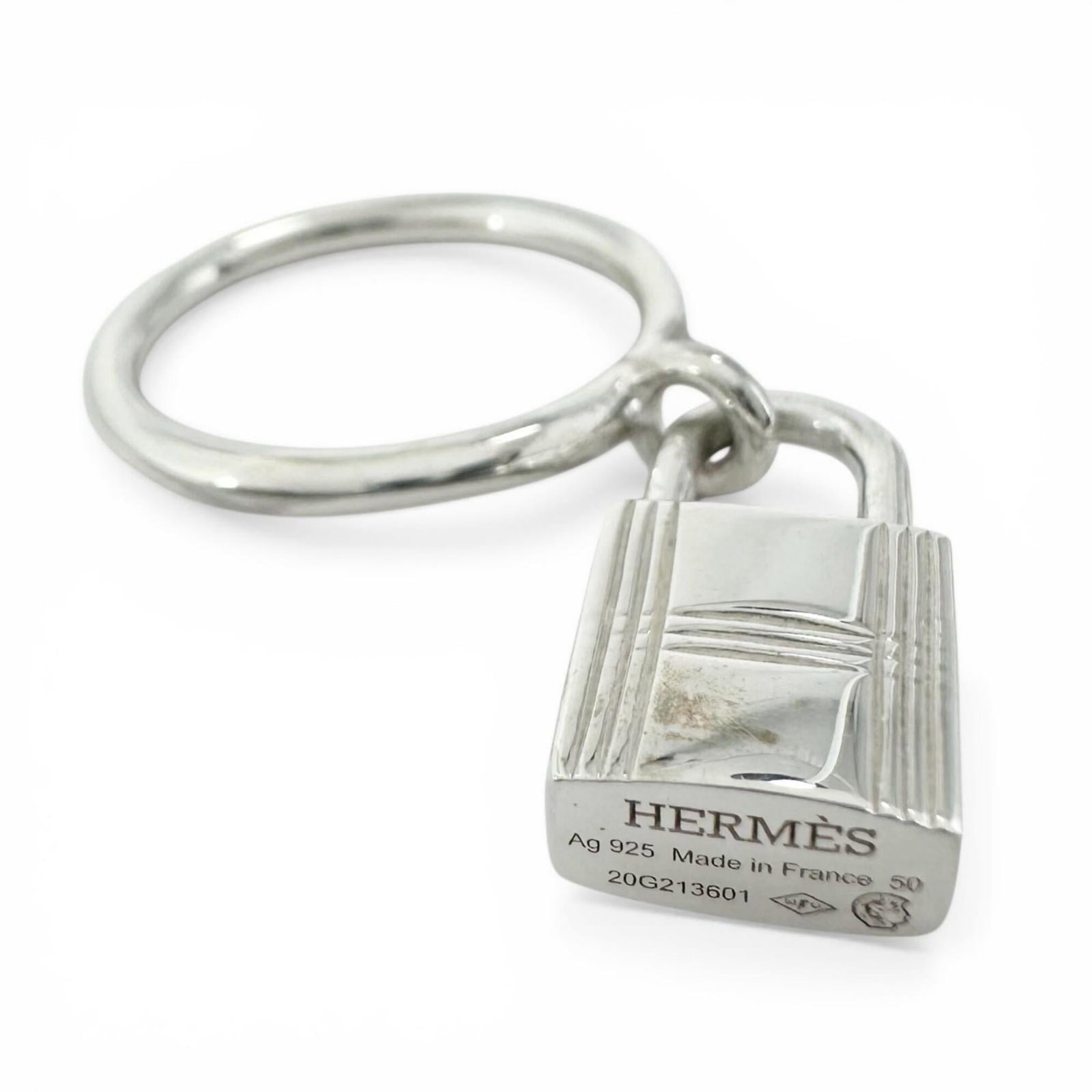 Ring of Silver Band by Hermes: Ring of Silver Band by Hermes Silver Band by Hermes features a sleek, minimalist design with a silver band made from 925 material. The ring's slender width and weight make it a stylish addition to