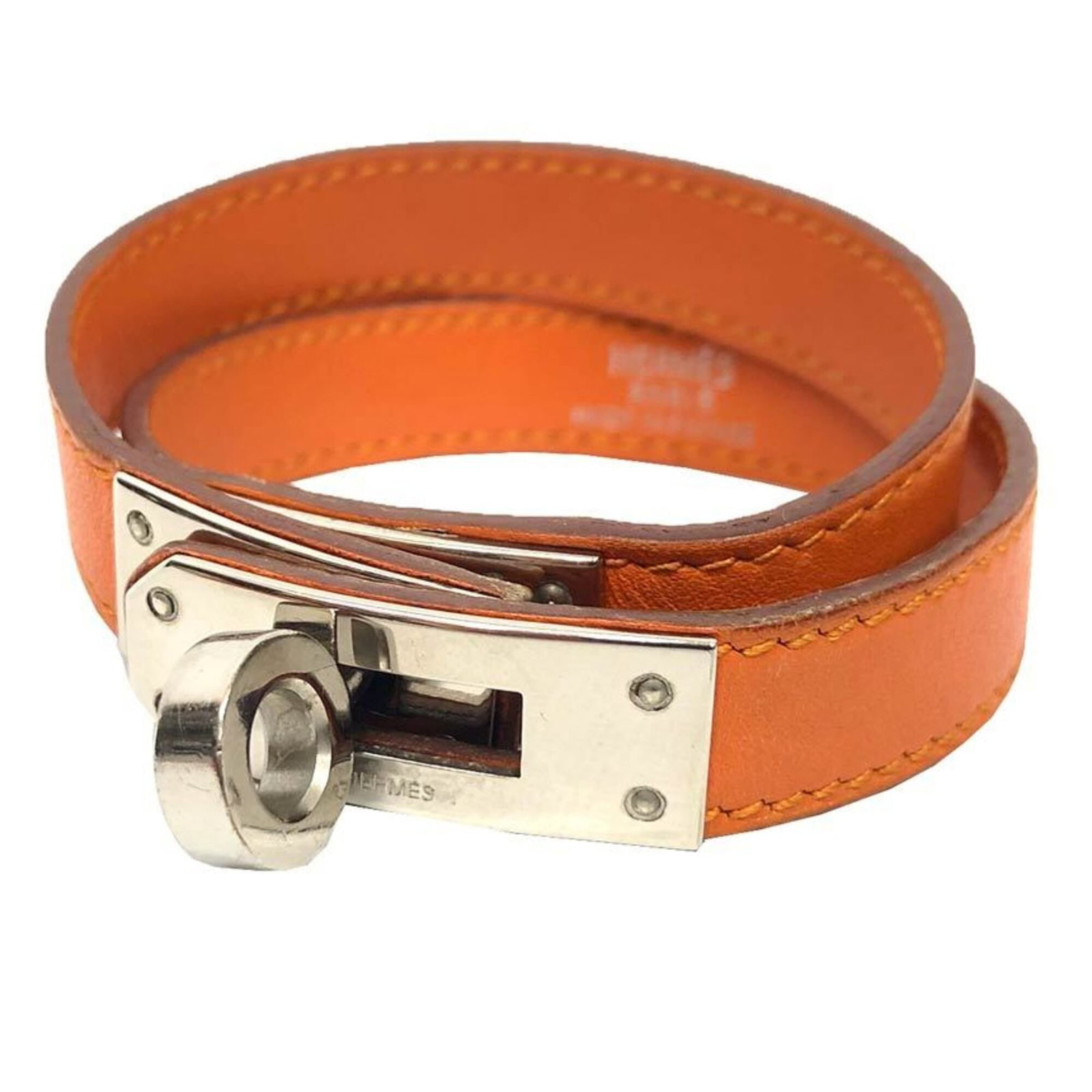 Hermes Charm Bracelet Leather: Hermes Charm Bracelet Leather Orange and silver leather charm bracelet from Hermes, measuring 36cm in length. This stylish accessory features a vibrant orange color paired with metallic accents, creat