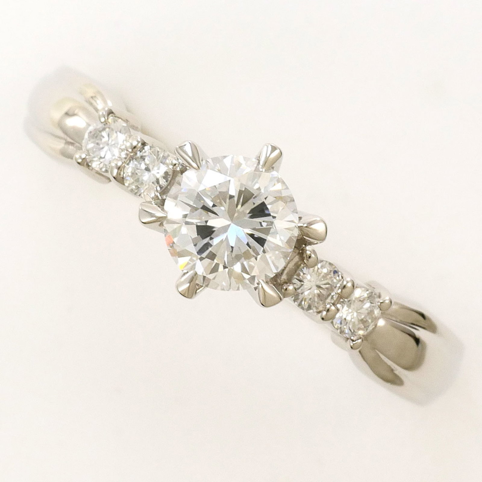 Unbranded Band Ring Platinum 900: Unbranded Band Ring Platinum 900 Platinum 900 band ring features a diamond stone, weighing 0.507 carats, set in a platinum metal construction with a US size 7 fit and 7mm width. The item weighs 4.2g a