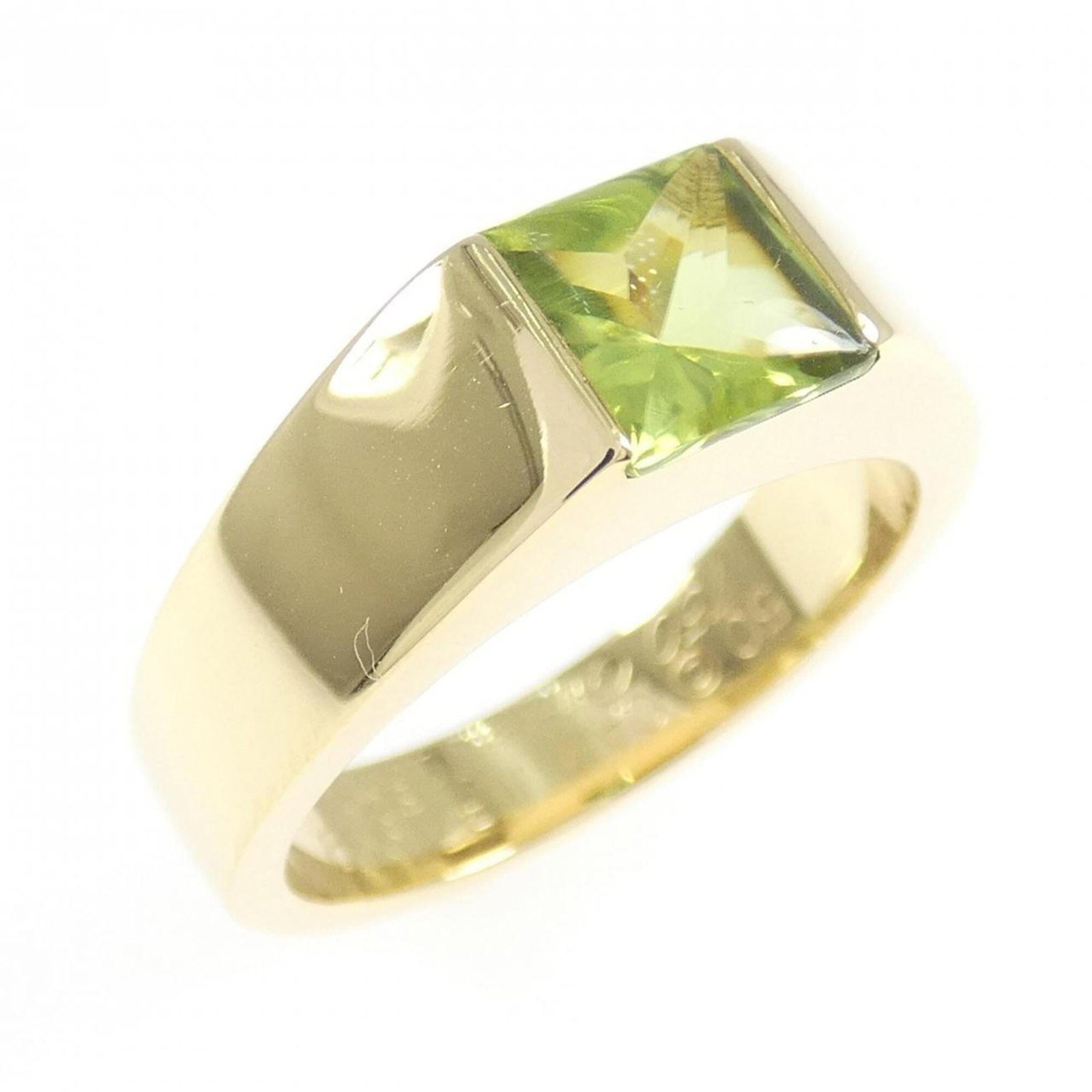 Yellow Gold Cartier 18K Ring: Yellow Gold Cartier 18K Ring Yellow Gold Cartier 18K Ring features a peridot stone and is made from 18K yellow gold, with a band size of 50 US. This ring falls in size 5.5. The piece bears the signatu