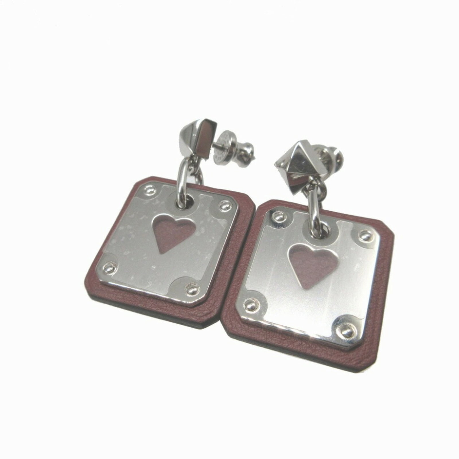 Hermes Stud Earrings Leather Metal: Hermes Stud Earrings Leather Metal Stud earrings from Hermes feature brown leather and silver metal, making for a stylish accessory. The item comes with a dust bag for added protection and care. A lux