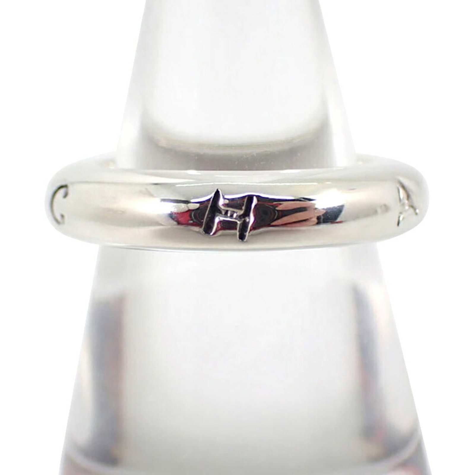 Sterling silver ring by Chanel band.: Sterling silver ring by Chanel band. Sterling silver band ring by Chanel, featuring the iconic brand's signature style. This 925 sterling silver ring boasts a classic design with a size 6.5 band, perf