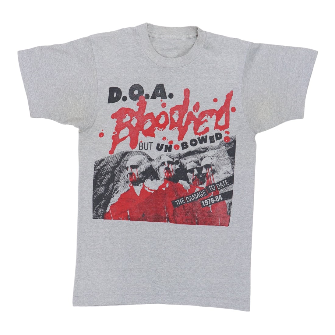 Bloodied Shirt Unbowed Doa 1984: Bloodied Shirt Unbowed Doa 1984 The DOA Bloodied But Unbowed Shirt, originally released in 1984, boasts a distinctive gray color and 50/50 poly/cotton material. Measuring 27" collar to hem and 17" pit