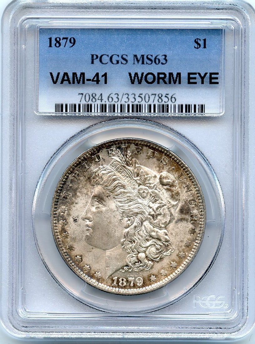 C8413- 1879 VAM-41 WORM EYE MORGAN DOLLAR PCGS MS63: C8413- 1879 VAM-41 WORM EYE MORGAN DOLLAR PCGS MS63 The C8413-1879 VAM-41 Worm Eye Morgan Dollar is a highly graded MS63 specimen, certified by PCGS. This uncirculated coin boasts a unique worm eye de