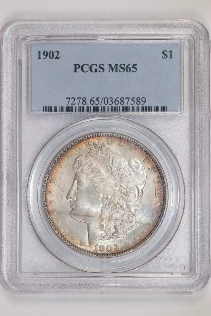 MORGAN DOLLAR PRETTY COLOR MS65 PCGS: MORGAN DOLLAR PRETTY COLOR MS65 PCGS MS65 PCGS graded Morgan Dollar from 1902, certified by the Professional Coin Grading Service (PCGS) with an MS 65 grade indicating a high level of preservation and