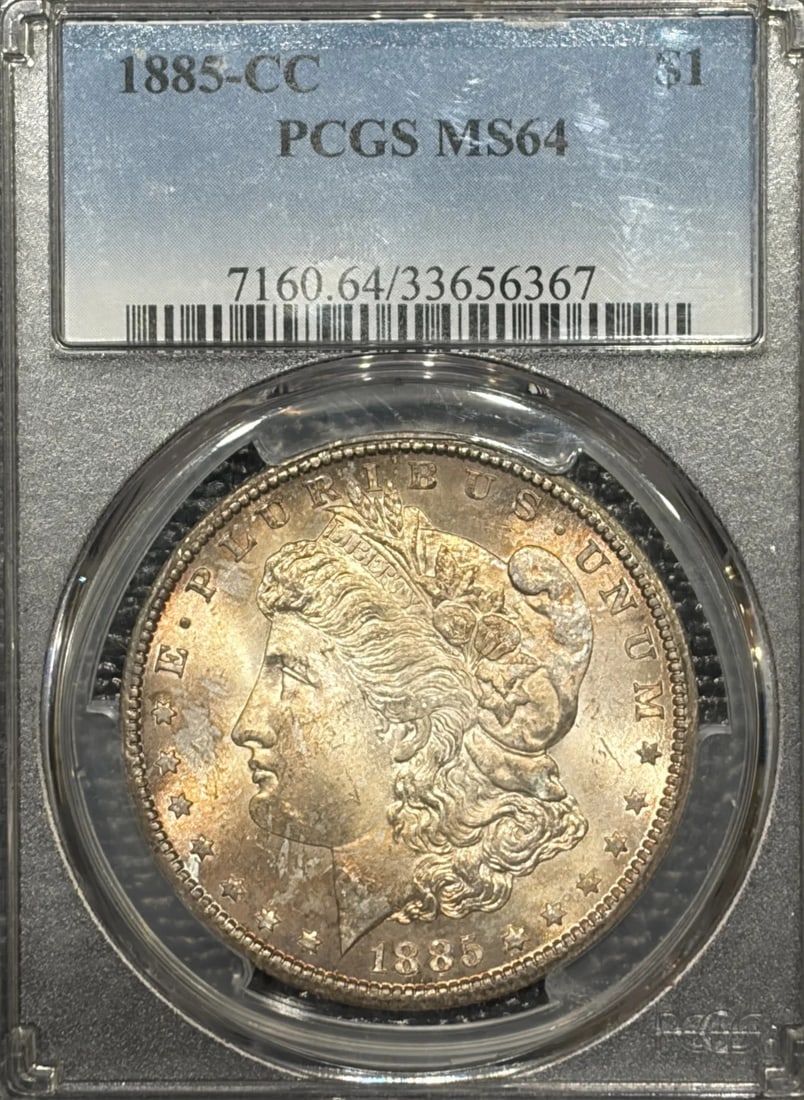 1885-CC MORGAN DOLLAR PCGS MS64: 1885-CC MORGAN DOLLAR PCGS MS64 The 1885-CC Morgan Dollar, graded MS64 by PCGS, showcases exceptional silver content and meticulous minting. Certified with a unique certification number, this coin bea