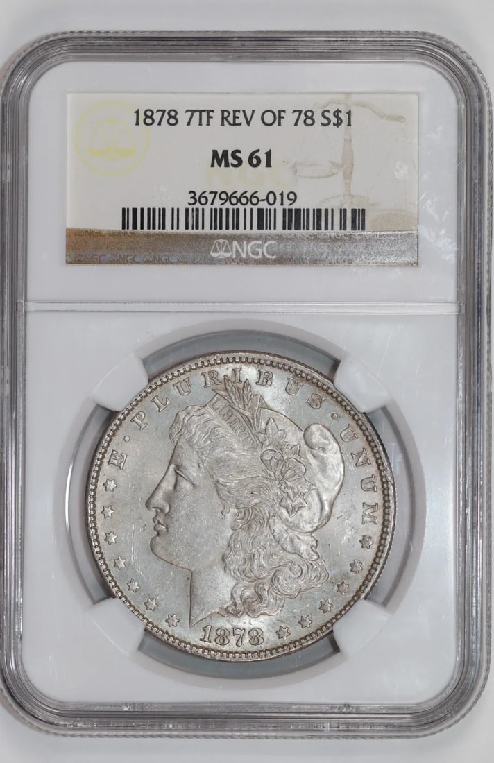 1878 7TF REVERSE 1878 MORGAN DOLLAR NGC MS61 #3679666-019: 1878 7TF REVERSE 1878 MORGAN DOLLAR NGC MS61 #3679666-019 The 1878 Morgan Dollar, graded MS61 by the Numismatic Guaranty Corporation (NGC), boasts a rich history and stunning silver composition. This 