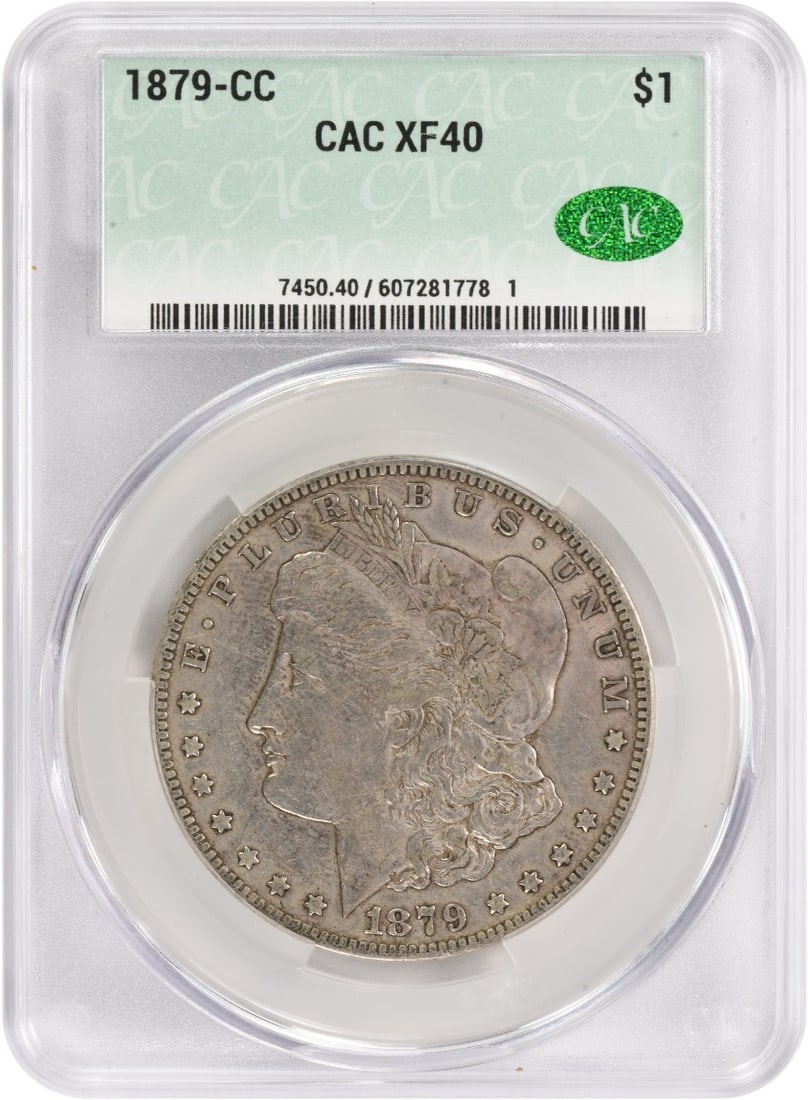 Morgan Silver Dollar 1879 CACG EF40 CC: Morgan Silver Dollar 1879 CACG EF40 CC Circulated in 1879, this Morgan Silver Dollar boasts an EF40 grade and CC mint mark, indicating a high level of preservation. With its 90% silver composition and