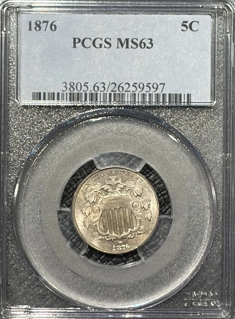 1876 SHIELD NICKEL PCGS MS63: 1876 SHIELD NICKEL PCGS MS63 1876 Shield Nickel PCGS MS63 - A Highly Detailed, Uncirculated Coin. This 1876 Shield Nickel is certified by the Professional Coin Grading Service (PCGS) with a grade of M