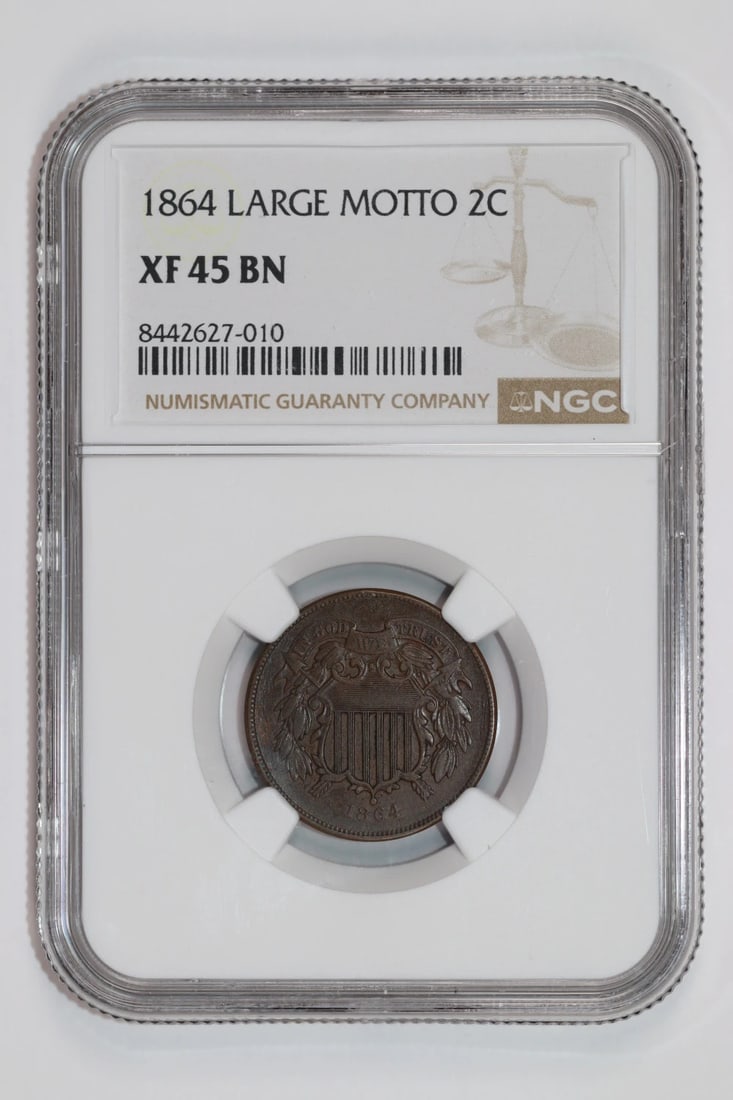 1864 LARGE MOTTO TWO CENT PIECE NGC XF45 BN: 1864 LARGE MOTTO TWO CENT PIECE NGC XF45 BN The 1864 Large Motto Two Cent piece, graded XF 45 by the NGC, boasts an impressive level of detail and wear. Circulated in 1864, this copper coin features a