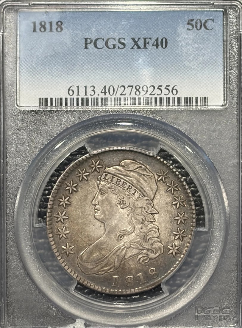 1818 BUST HALF DOLLAR PCGS XF40: 1818 BUST HALF DOLLAR PCGS XF40 The 1818 Bust Half Dollar, graded XF40 by PCGS, showcases its silver composition and historical significance. Certified in Philadelphia, this coin bears the distinctive