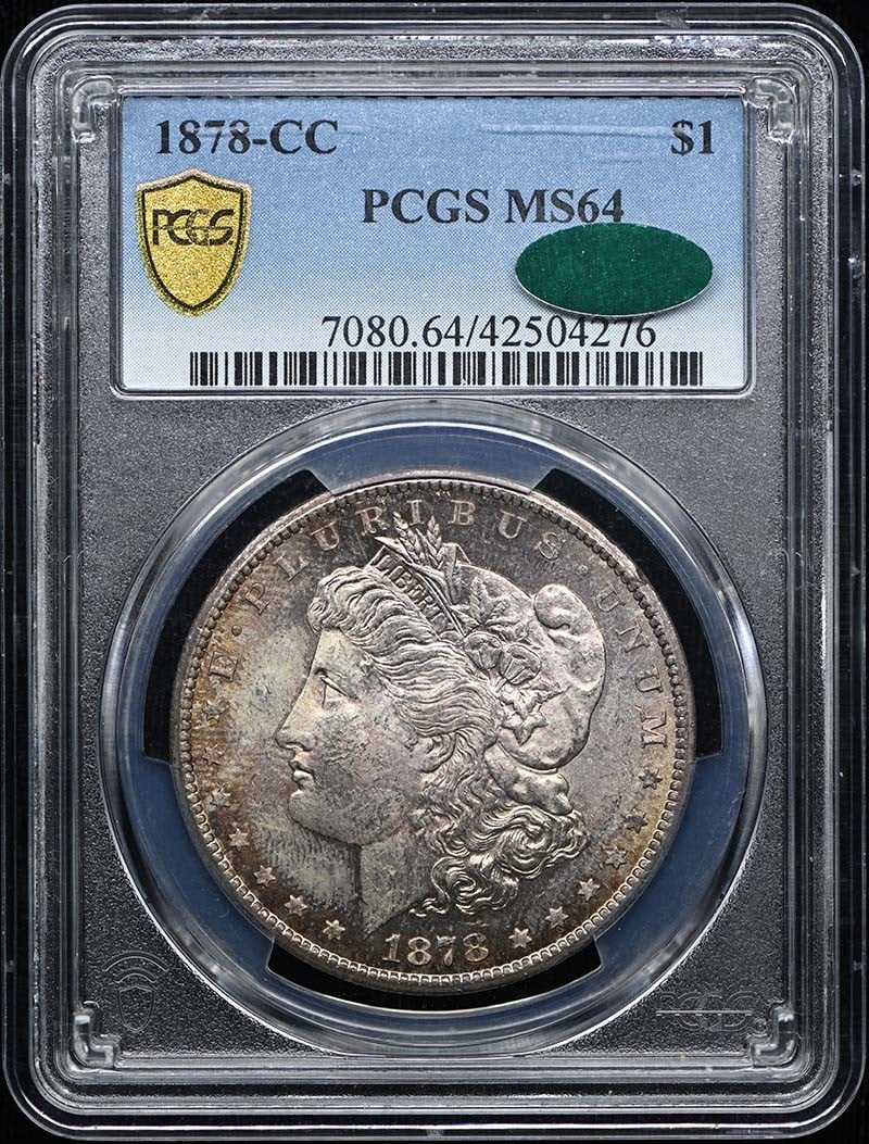 1878-CC $1 Morgan Dollar PCGS MS64 (CAC): 1878-CC $1 Morgan Dollar PCGS MS64 (CAC) The PCGS MS64 graded 1878-CC Morgan Dollar is an uncirculated coin with a high level of detail and luster. This Carson City minted dollar features the iconic d