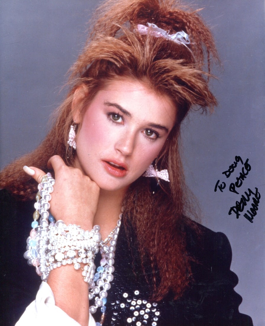 Demi Moore Autographed 8x10 Photo: Demi Moore Autographed 8x10 Photo Demi Moore's striking presence shines through in this 8x10 photo, signed in black sharpie across the front. The image bears a signature from Demi Moore, verified by R