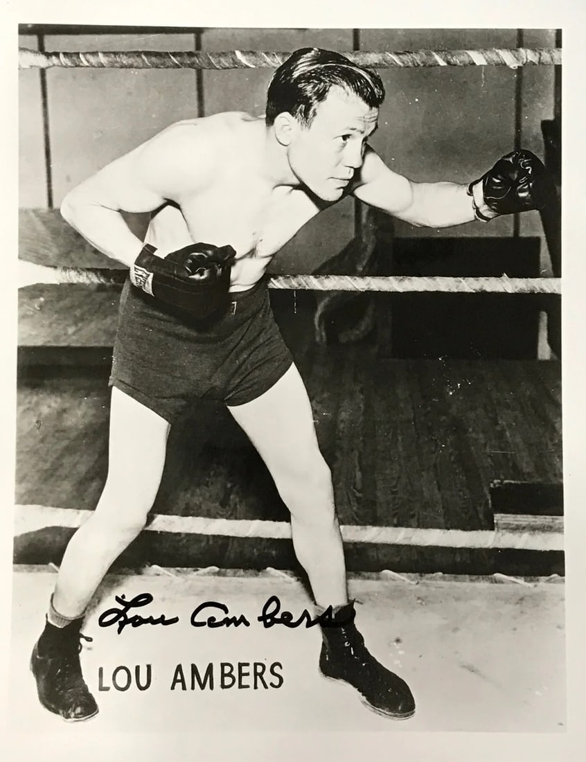 Lou Ambers Autographed Black & White 8x10 Boxing Photo: Lou Ambers Autographed Black & White 8x10 Boxing Photo Lou Ambers' iconic black and white boxing photo, signed across the front in sharpie, captures his enduring presence in the sport. This rare 8x10 