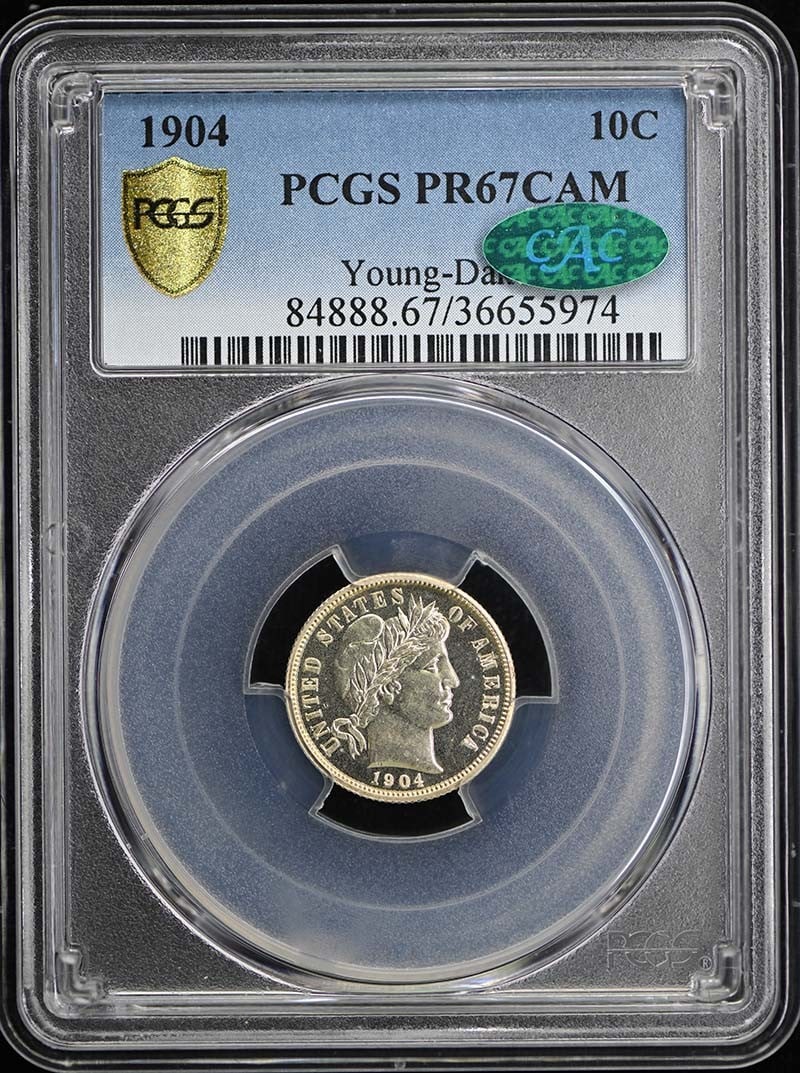 1904 10C Barber Dime PCGS PR67CAM (CAC): 1904 10C Barber Dime PCGS PR67CAM (CAC) The 1904 Barber Dime, graded PR67CAM by PCGS, boasts exceptional condition with minimal imperfections. This uncirculated proof coin features the iconic Barber d
