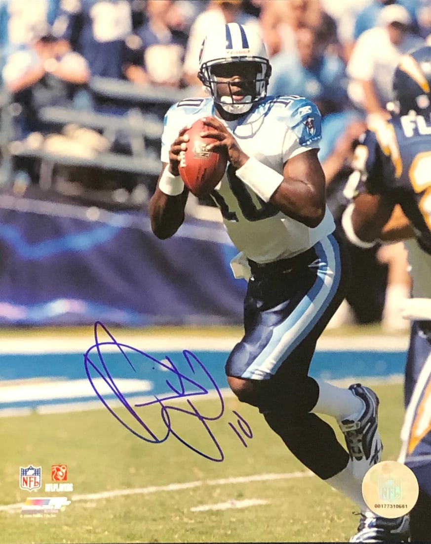 Vince Young Autographed Photo: Vince Young Autographed Photo Item Specifics: Vince Young Autographed 8x10 Photo-Tennessee Titans.Signed in sharpie across the front of the photo Autograph is authenticated by , and will be accompanie