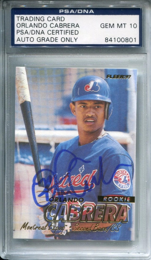 Orlando Cabrera Autographed 1997 Fleer Rookie Card PSA 10: Orlando Cabrera Autographed 1997 Fleer Rookie Card PSA 10 The Orlando Cabrera Autographed 1997 Fleer Rookie Card PSA 10 features a sharpie signature across the front, graded Mint 10 by PSA/DNA. This c