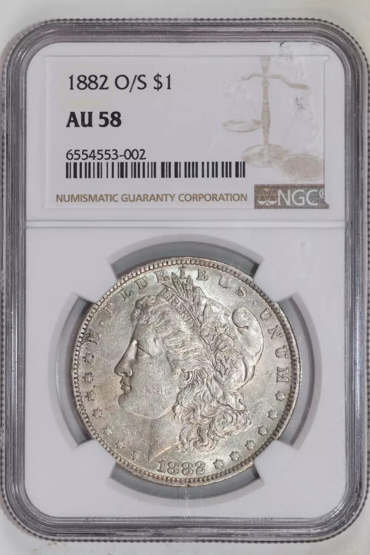 STRONG MORGAN DOLLAR S 1882-NGC AU58: STRONG MORGAN DOLLAR S 1882-NGC AU58 The STRONG MORGAN DOLLAR S 1882-NGC AU58 is a circulated example from the New Orleans mint, bearing the NGC certification number 6554553-002. This silver dollar fe