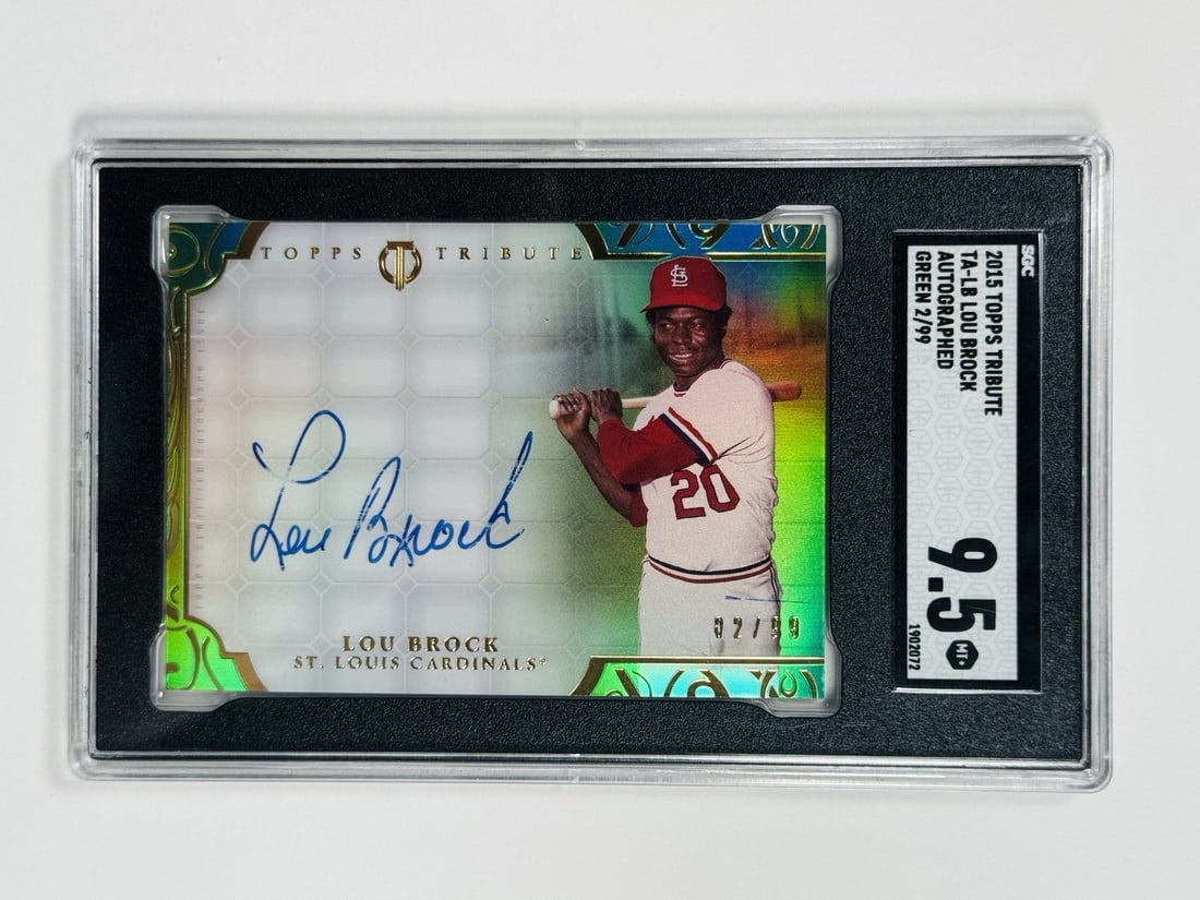 2015 TOPPS TRIBUTE LOU BROCK #TA-LB GREEN AUTO/ 99 SGC 9.5: 2015 TOPPS TRIBUTE LOU BROCK #TA-LB GREEN AUTO/ 99 SGC 9.5 Lou Brock's 2015 Topps Tribute #TA-LB features a rare green auto, one of only 99 hard signed prints. The card boasts an impressive SGC 9.5 gr