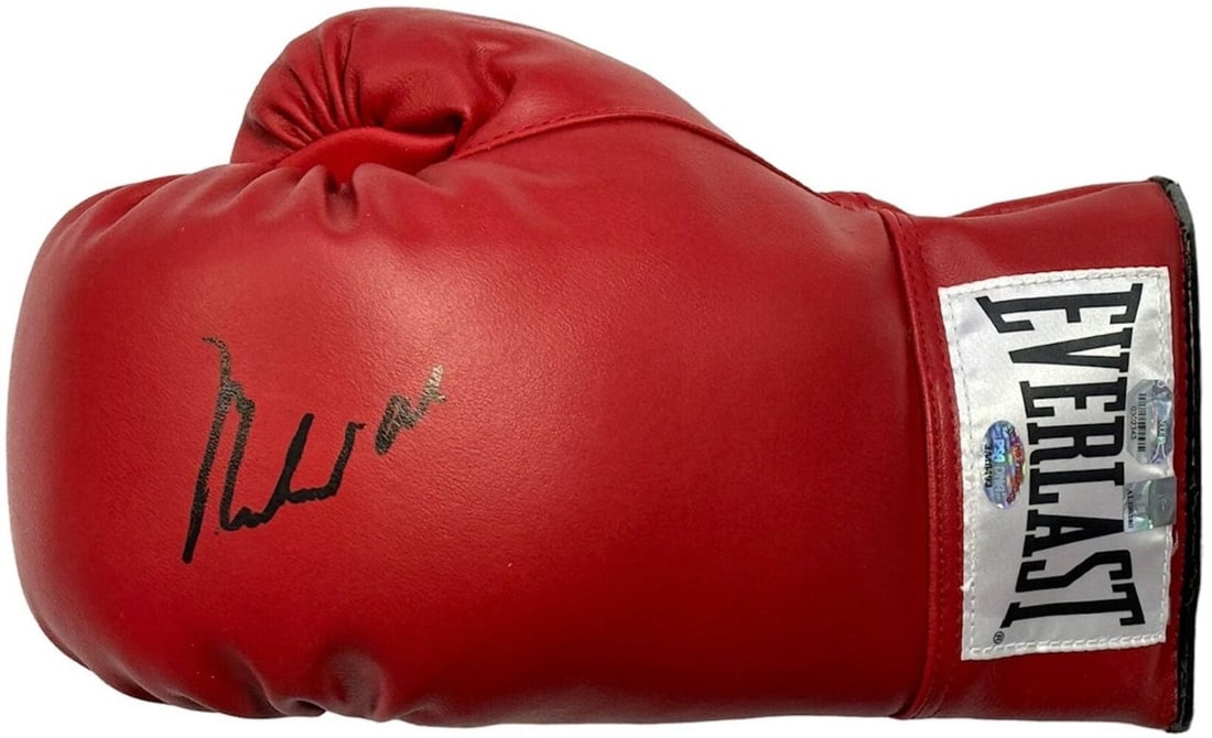 Muhammad Ali Autographed Red Everlast Left Hand Boxing Glove (PSA) Auto Grade 10: Muhammad Ali Autographed Red Everlast Left Hand Boxing Glove (PSA) Auto Grade 10 Signed in black sharpie across the front of the boxing glove, Muhammad Ali's autograph adds a touch of legendary histor