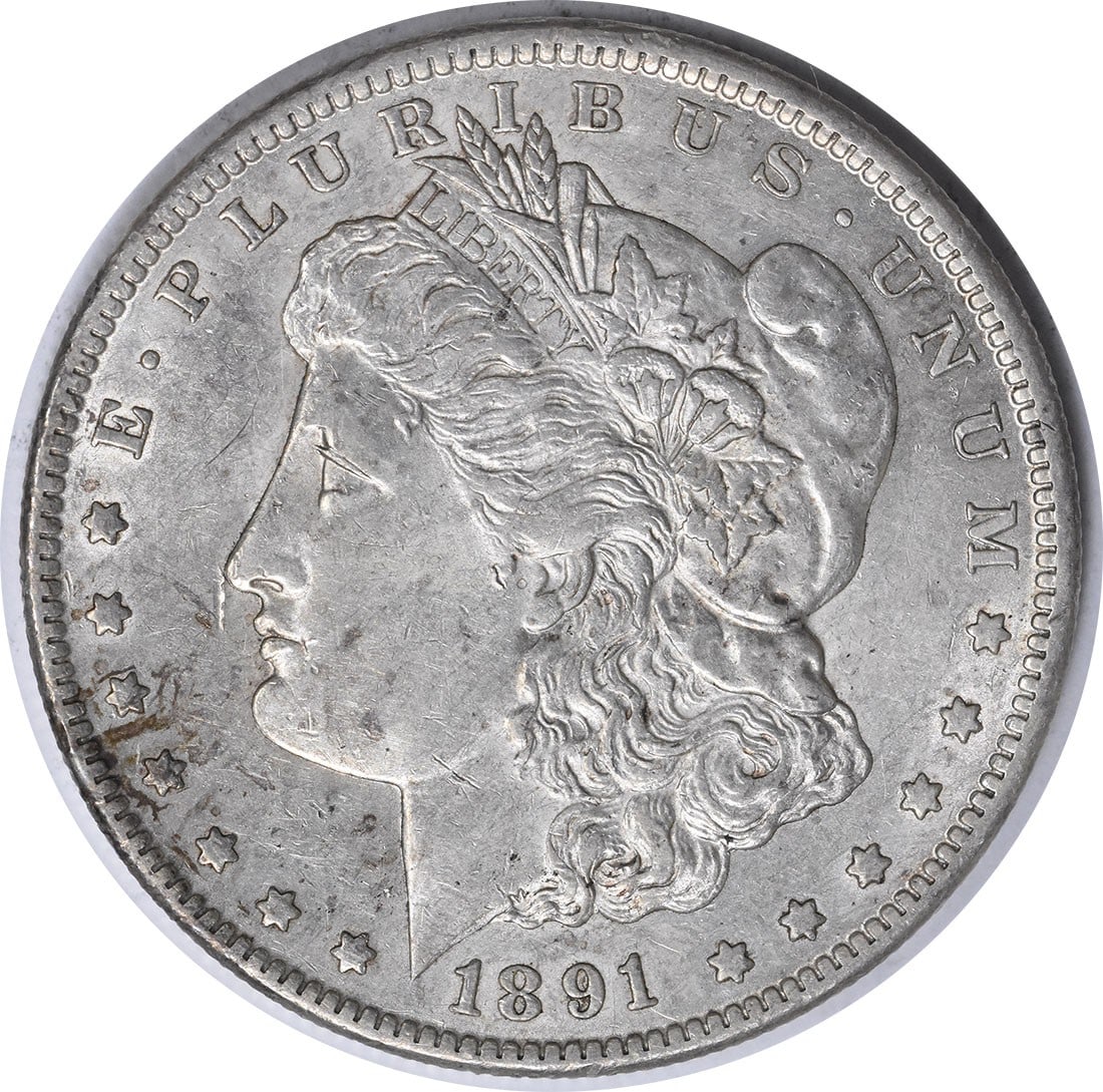 1891-CC Morgan Silver Dollar AU Slider Uncertified: 1891-CC Morgan Silver Dollar AU Slider Uncertified The 1891-CC Morgan Silver Dollar AU Slider Uncertified boasts an impressive silver composition, weighing in at 26.73 grams and featuring a reeded edg