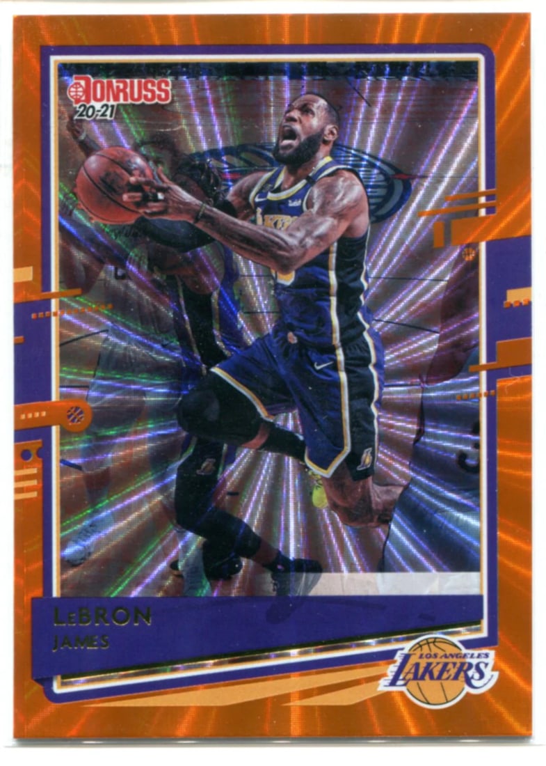 James LeBron 2020-21 Laser Orange Card Donruss #12: James LeBron 2020-21 Laser Orange Card Donruss #12 Laser Orange Card #12 from the LeBron James 2020-21 Donruss set, featuring an orange laser finish that adds a unique touch to this premium