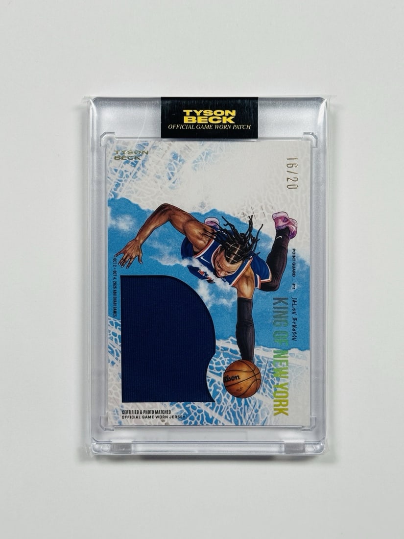 2026 TYSON BECK X JALEN BRUNSON KING OF NEW YORK PATCH GAME WORN/ 20: 2026 TYSON BECK X JALEN BRUNSON KING OF NEW YORK PATCH GAME WORN/ 20 The 2026 Tyson Beck X Jalen Brunson King of New York Patch Game Worn/20 features an autographed card with a signature, part of the