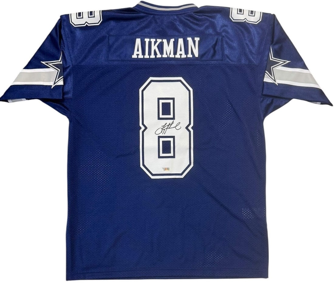Authentic Aikman Autographed Troy Mitchell & Ness Fanatics Cowboys Jersey: Authentic Aikman Autographed Troy Mitchell & Ness Fanatics Cowboys Jersey Authentic Troy Aikman Autographed Mitchell & Ness Fanatics Cowboys Jersey. This 1996 Throwback jersey, certified by Fanatics (