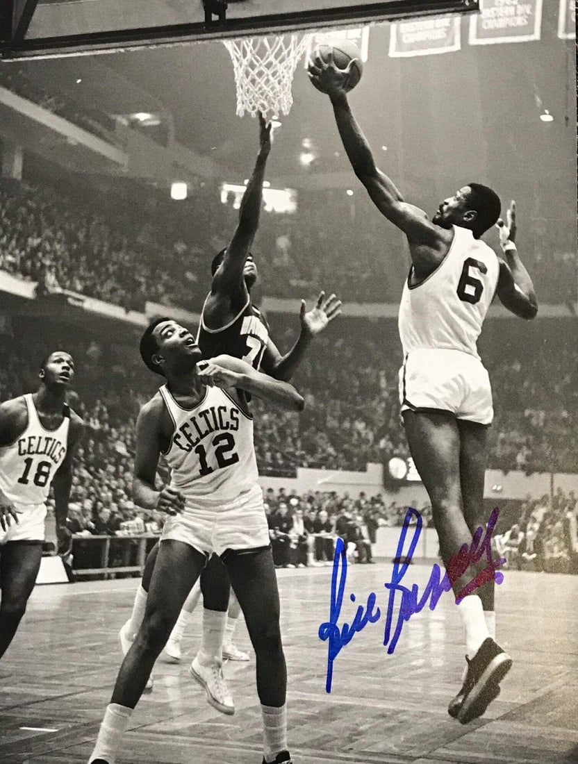 8x10 Basketball Photo Autographed by Bill Russell: 8x10 Basketball Photo Autographed by Bill Russell Signed across the front of the photo in blue sharpie, this 8x10 basketball photo features the legendary Bill Russell. The Boston Celtics icon's signat