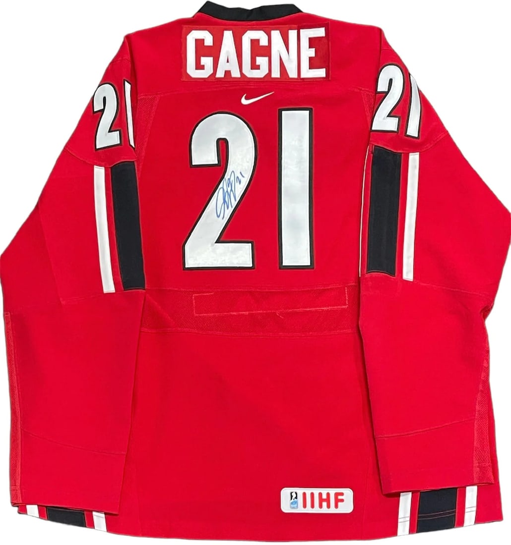 Simon Gagne Autographed Team Canada Hockey Jersey: Simon Gagne Autographed Team Canada Hockey Jersey Simon Gagne's iconic number on the back of his Team Canada jersey bears a distinctive blue sharpie signature. This unique piece of hockey history show