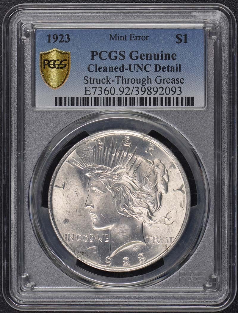 $1 Peace Dollar $1923 PCGS Grease Struck-Through Error: $1 Peace Dollar $1923 PCGS Grease Struck-Through Error The $1 Peace Dollar, certified by PCGS as Grease Struck-Through Error, showcases an unusual minting anomaly from 1923. This uncirculated coin fea