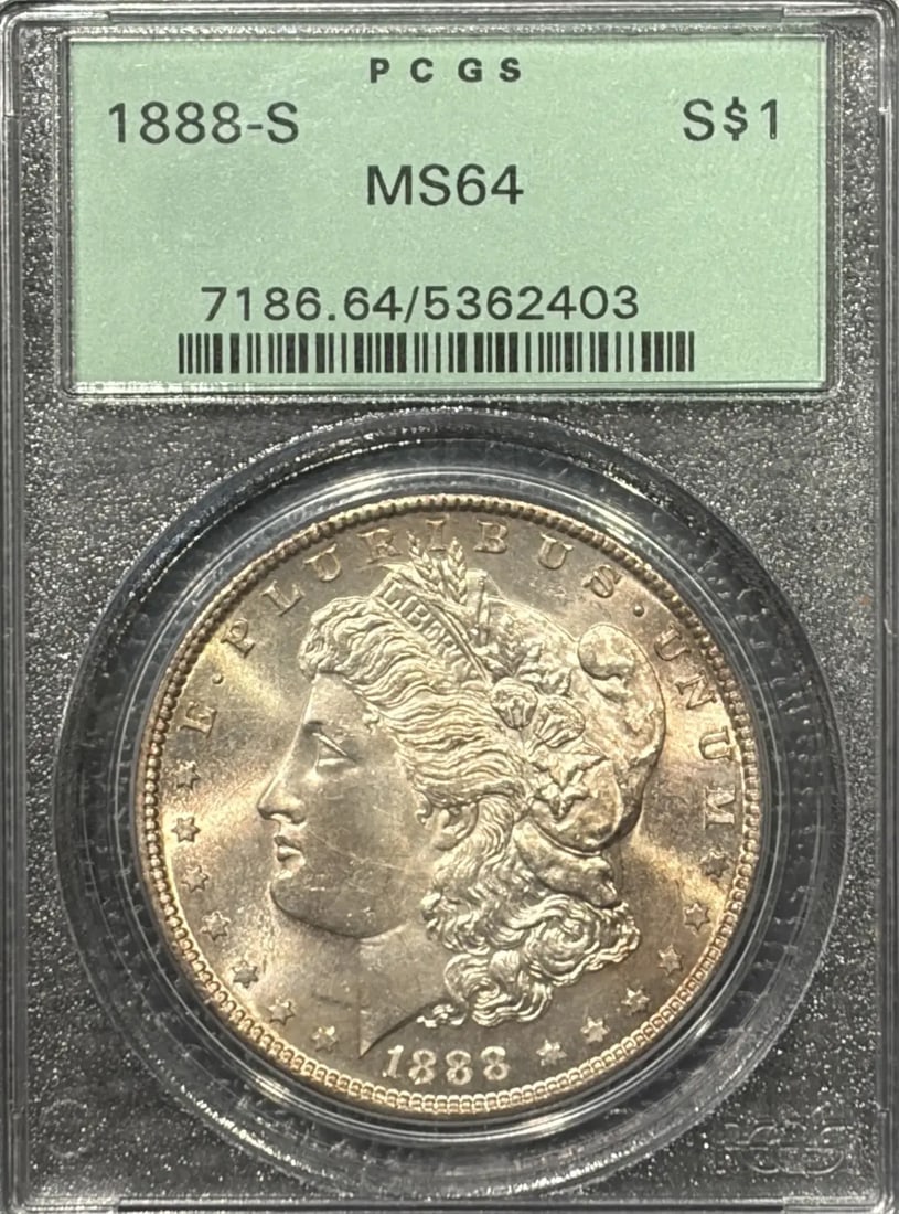 1888-S MORGAN DOLLAR PCGS MS64 OGH VERY PQ: 1888-S MORGAN DOLLAR PCGS MS64 OGH VERY PQ The 1888-S Morgan Dollar, graded MS64 by PCGS, boasts exceptional condition with only minor wear. This uncirculated coin features the iconic design of George