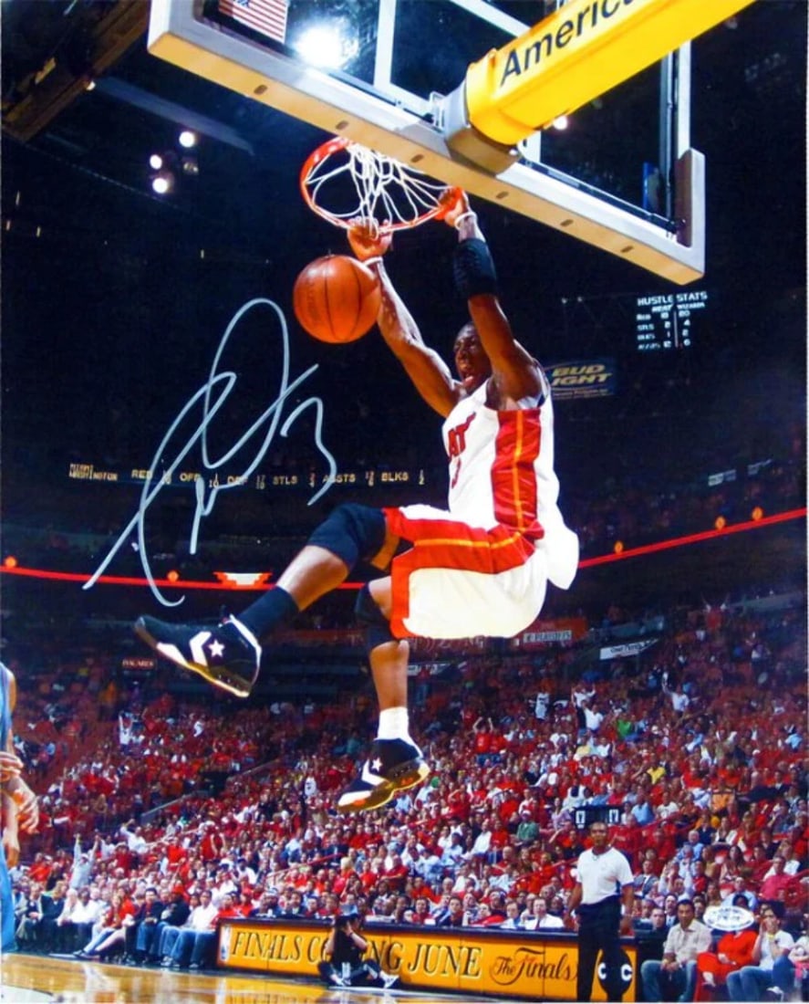 Dwyane Wade 2 Hand Dunk Autographed 16x20 Photo: Dwyane Wade 2 Hand Dunk Autographed 16x20 Photo Dwyane Wade's 2 Hand Dunk Autographed Photo is an exclusive piece from his rookie season, featuring the Miami Heat legend in action. Signed in silver sh