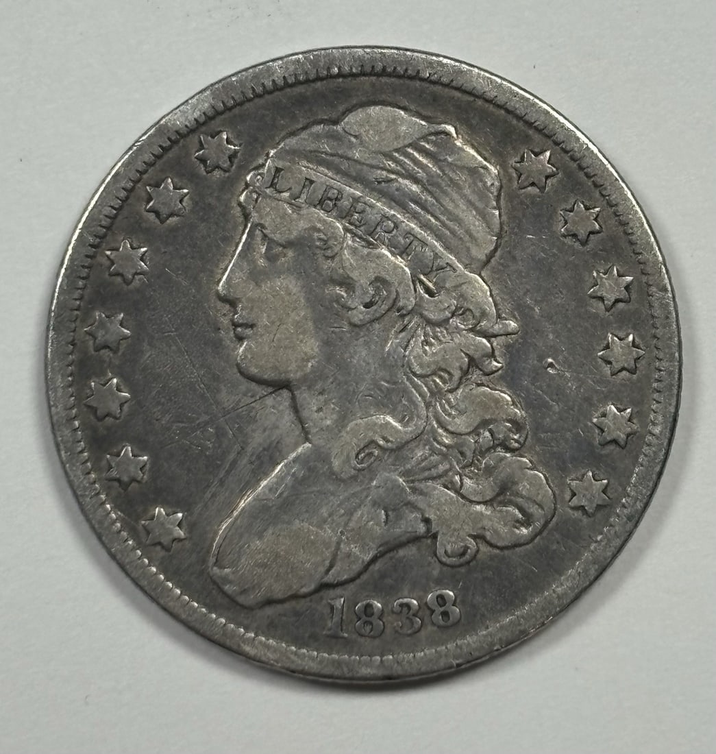 1838 CAPPED BUST QUARTER VF/ XF DETAILS: 1838 CAPPED BUST QUARTER VF/ XF DETAILS Capped Bust Quarter from 1834, featuring the iconic design with a strong, defined profile. This circulated coin showcases excellent details, including its VF/ X