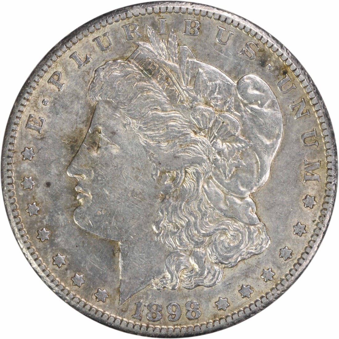 1898-S Morgan Silver Dollar AU Uncertified: 1898-S Morgan Silver Dollar AU Uncertified The 1898-S Morgan Silver Dollar features a striking reeded edge and a distinctive mint mark, setting it apart from its circulated counterparts. This Uncertif