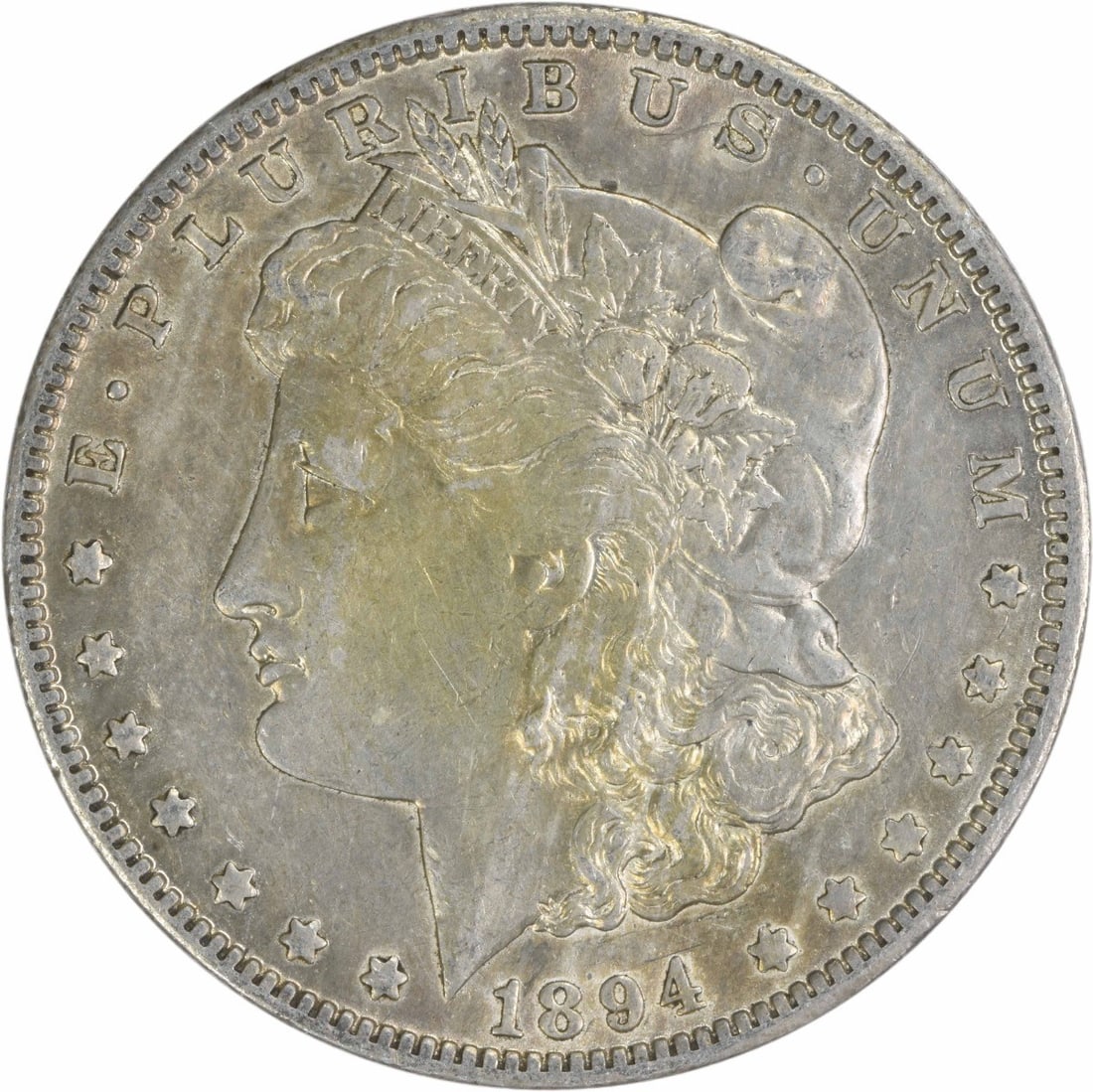 1894-O Morgan Silver Dollar AU Uncertified: 1894-O Morgan Silver Dollar AU Uncertified The 1894-O Morgan Silver Dollar features a distinctive reeded edge and a mint mark located on the reverse, signifying its origin from the New Orleans Mint. T
