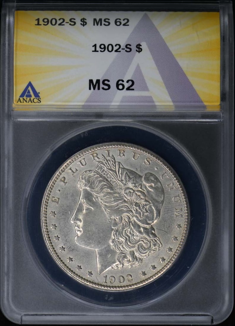 MS62 Morgan Dollar 1902-S Silver $1: MS62 Morgan Dollar 1902-S Silver $1 The MS62 Morgan Dollar 1902-S Silver $1 boasts an impressive grade, showcasing its exceptional condition. Certified by ANACS with a unique certification number, thi