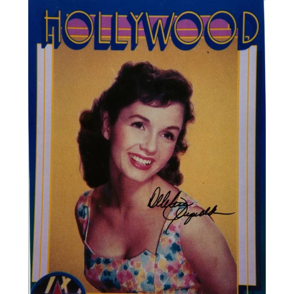 Debbie Reynolds Autographed 8x10 Photo: Debbie Reynolds Autographed 8x10 Photo Debbie Reynolds' iconic smile shines bright in this 8x10 photo, signed in black sharpie. The actress's enduring legacy is captured in this official photograph, a
