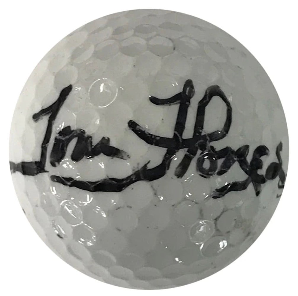 Slazenger Autographed by Tom Flores 4 Golf Ball: Slazenger Autographed by Tom Flores 4 Golf Ball Signed by NFL Coach Tom Flores in black sharpie, this Slazenger Autographed Golf Ball bears the mark of a sports legend. The ball's simple design and sl