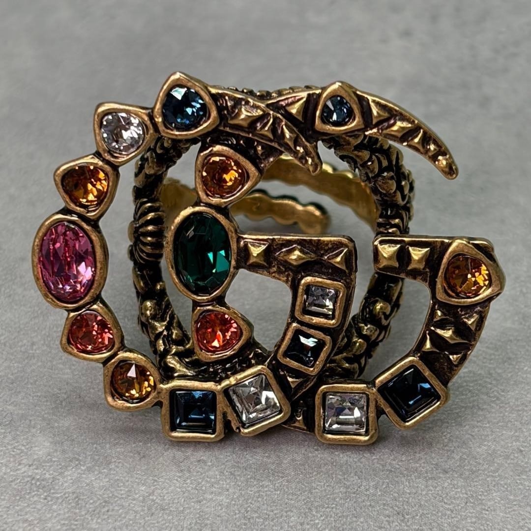 Rare multicolored stone gold ring GG Double G US7-8: Rare multicolored stone gold ring GG Double G US7-8 Item Specifics: Ring Size: 7-8 Brand: Gucci Type: Ring Metal Purity: 925 Color: Gold Style: Ring Material: Metal Main Stone: Colored Stone Product
