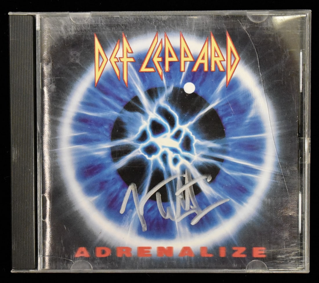 Joe Elliott Signed/ Autographed Def Leppard Adrenalize CD Cover JSA BA208656: Joe Elliott Signed/ Autographed Def Leppard Adrenalize CD Cover JSA BA208656 Joe Elliott's signature appears on the CD cover of Def Leppard's Adrenalize, bearing the authentication mark from JSA (Jame
