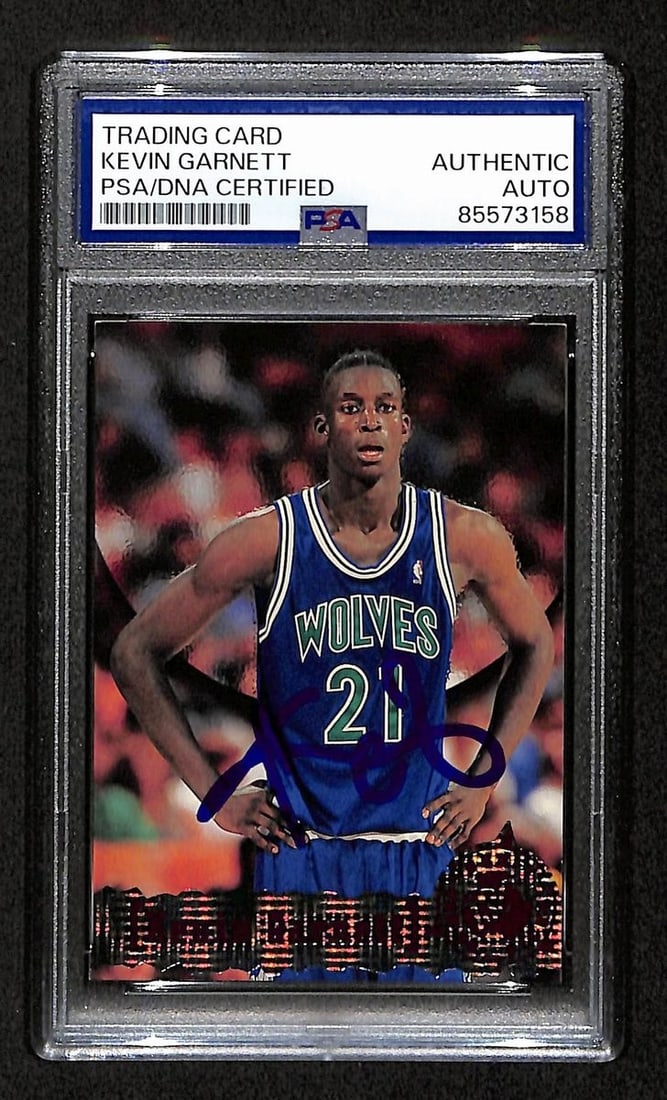 Kevin Garnett HOF Signed/ Auto On Card 1995-96 TOPPS RC Card #343 PSA/ DNA 198731: Kevin Garnett HOF Signed/ Auto On Card 1995-96 TOPPS RC Card #343 PSA/ DNA 198731 Signed by Kevin Garnett, the Hall of Fame forward, on a 1995-96 Topps Rookie Card (#343) featuring his iconic rookie s