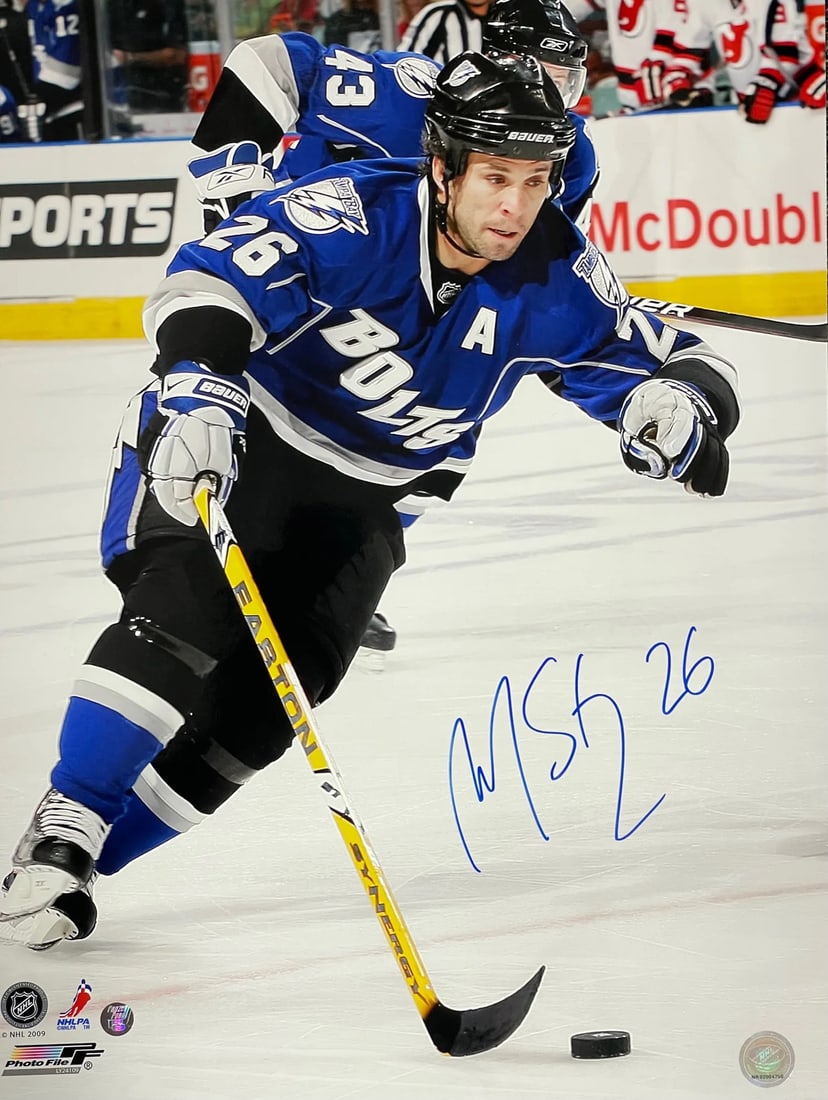 Hockey Photo Autographed By 16x20 Marin St Louis Tampa Bay Lightning: Hockey Photo Autographed By 16x20 Marin St Louis Tampa Bay Lightning Marin St Louis has signed this 16x20 hockey photo in blue sharpie across the front. The item bears the signature of a notable figur