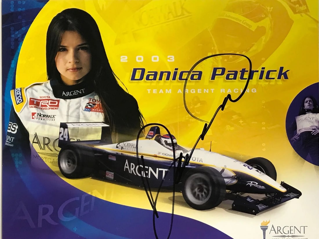 Danica Patrick Autographed 8x10 Racing Photo: Danica Patrick Autographed 8x10 Racing Photo Danica Patrick's racing spirit shines bright in this autographed 8x10 photo, signed across the front in black sharpie. The official image captures her dedi