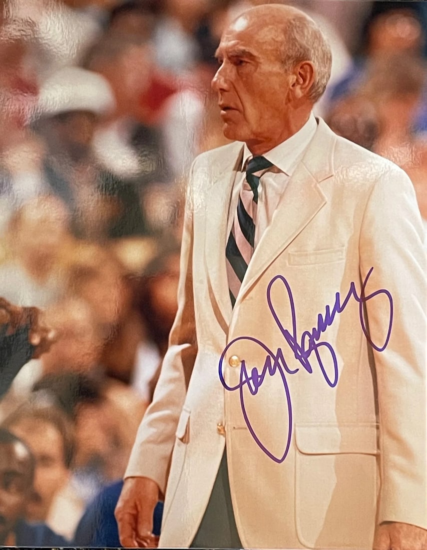 Jack Ramsey Autographed Basketball Photo: Jack Ramsey Autographed Basketball Photo Jack Ramsey's 8x10 basketball photo, signed across the front in blue sharpie. This unique piece bears the artist's mark, providing a tangible connection to the
